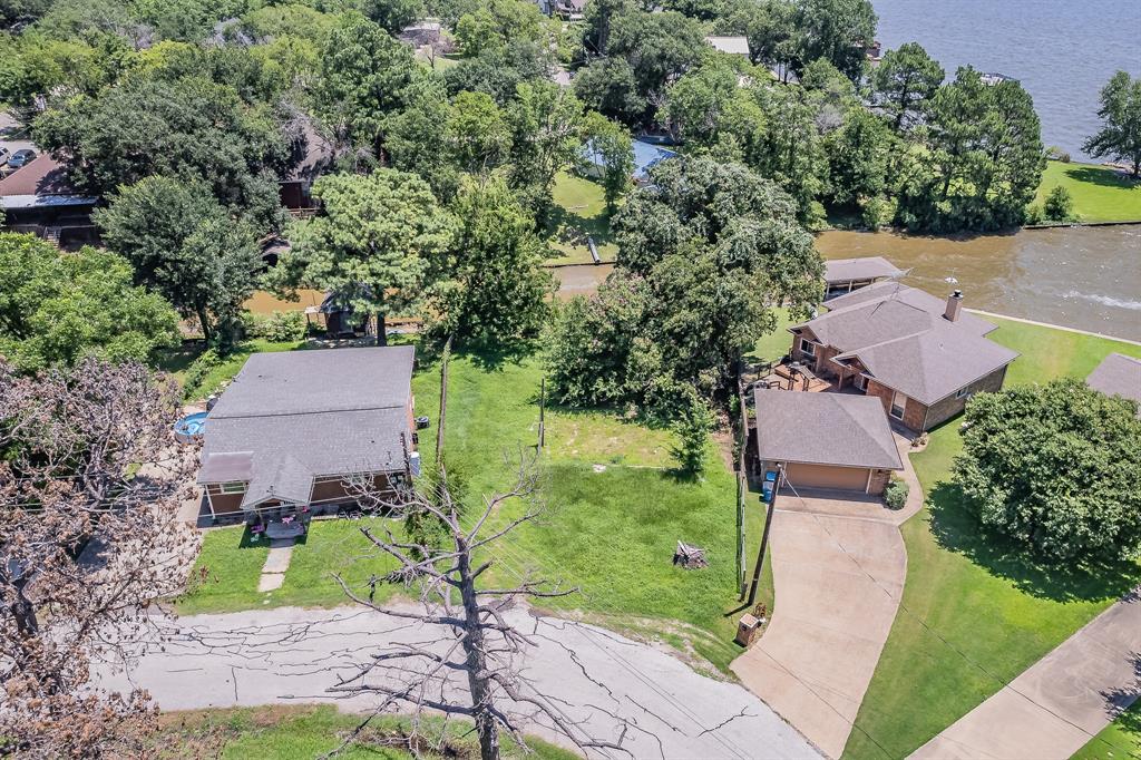 an aerial view of a house with a garden and trees