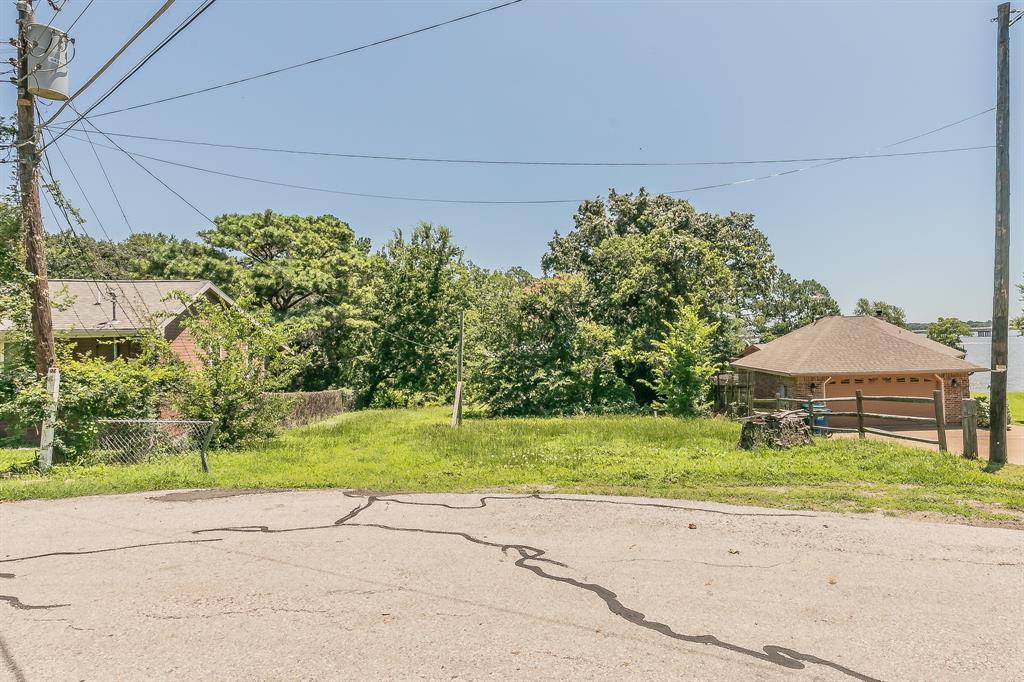 110 Ricky Road Gun Barrel City, TX 75156 - Photo 3 of 6 a backyard of a house with barbeque oven and outdoor seating