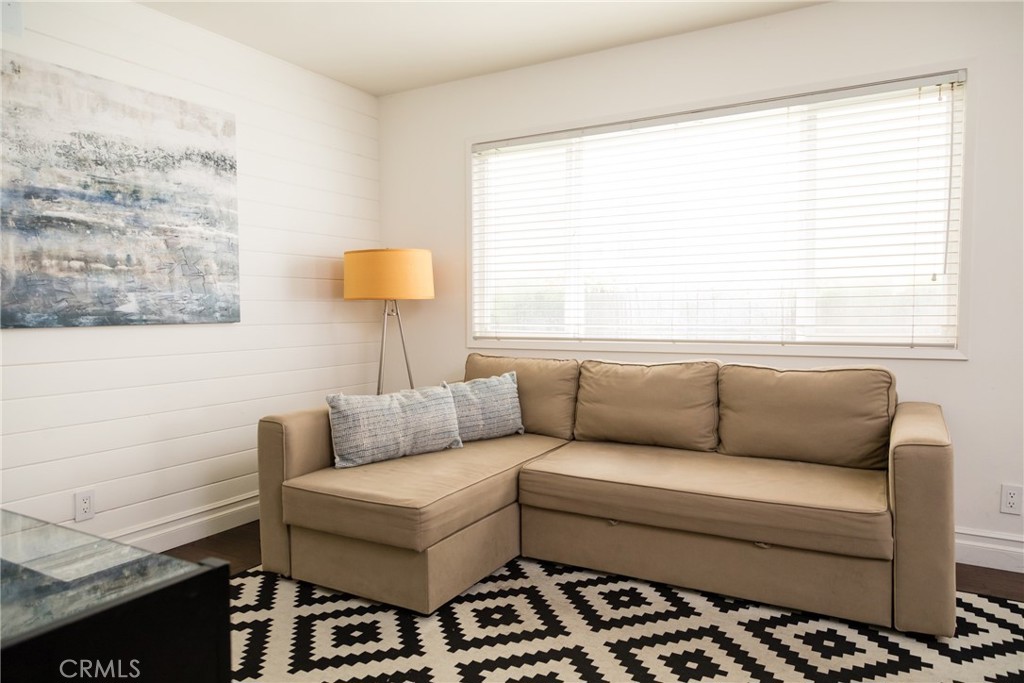 201 21st Place, Unit 2 Manhattan Beach, CA 90266 - Photo 12 of 25 a living room with furniture and a window