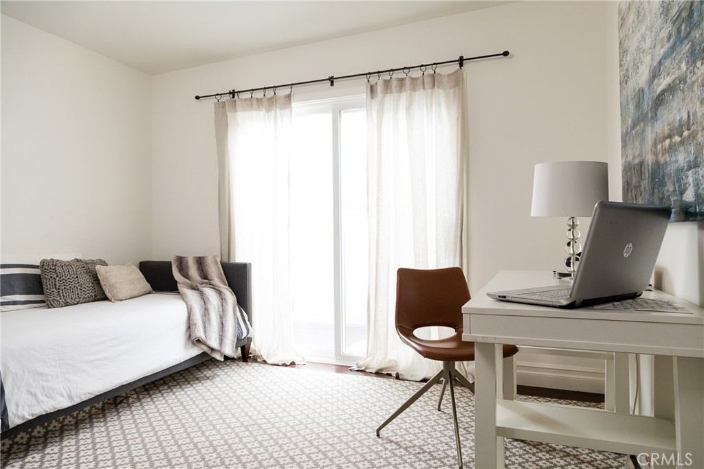 201 21st Place, Unit 2 Manhattan Beach, CA 90266 - Photo 16 of 25 a bedroom with a bed and a chair