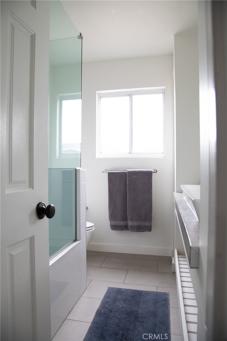 201 21st Place, Unit 2 Manhattan Beach, CA 90266 - Photo 19 of 25 a bathroom with a sink and mirror