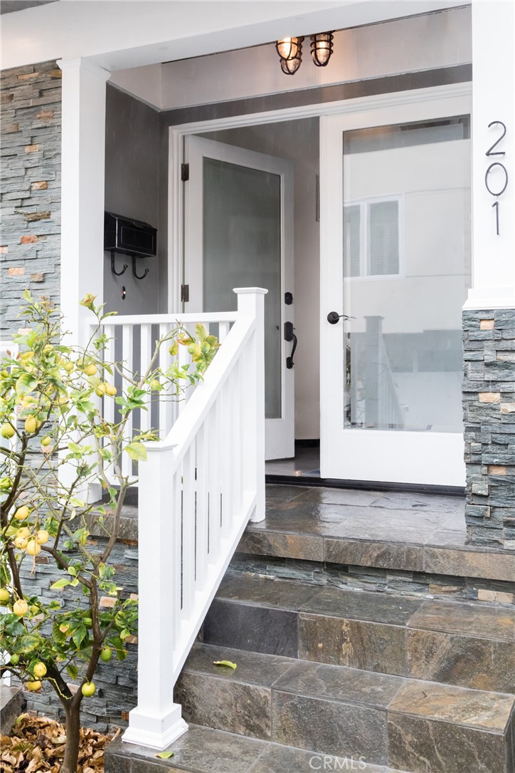 201 21st Place, Unit 2 Manhattan Beach, CA 90266 - Photo 2 of 25 a view of a staircase door