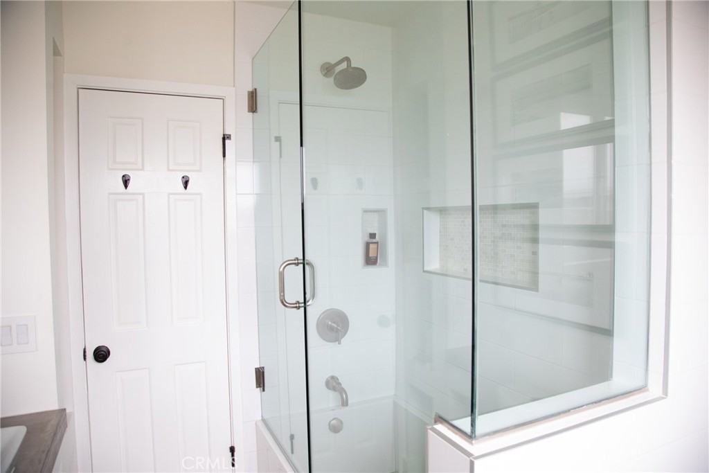 201 21st Place, Unit 2 Manhattan Beach, CA 90266 - Photo 10 of 25 a bathroom with a glass shower door