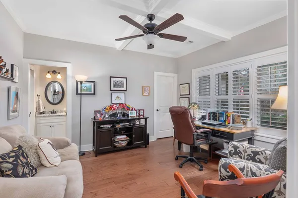 a bathroom with a granite countertop sink toilet and a mirror