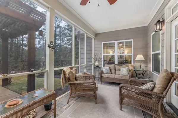 a view of swimming pool with outdoor seating