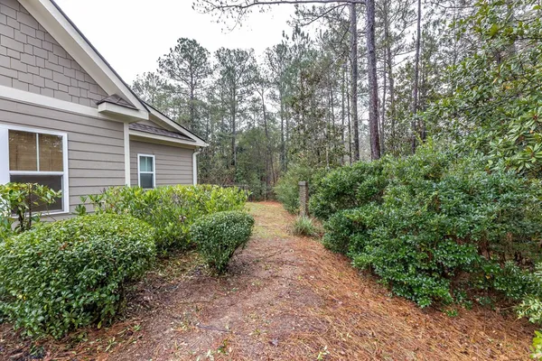 swimming pool view with a seating space