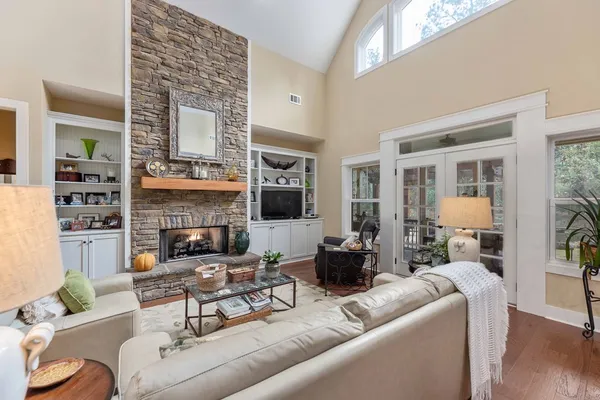 a living room with furniture and a large window