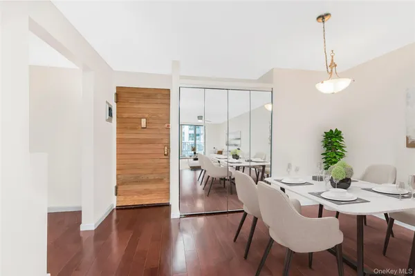a view of a dining room with furniture window and wooden floor