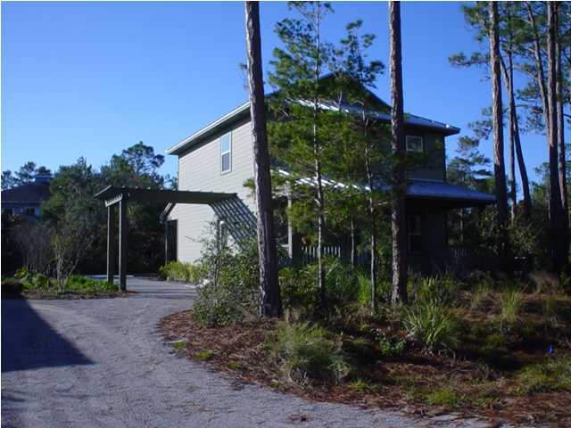 50 Spotted Dolphin Road Santa Rosa Beach, FL 32459 - Photo 2 of 10 a front view of a house with plants