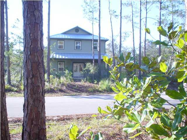 50 Spotted Dolphin Road Santa Rosa Beach, FL 32459 - Photo 4 of 10 a view of a brick house with a large tree in front of it