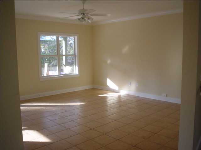 50 Spotted Dolphin Road Santa Rosa Beach, FL 32459 - Photo 6 of 10 a view of empty room with wooden floor and fan