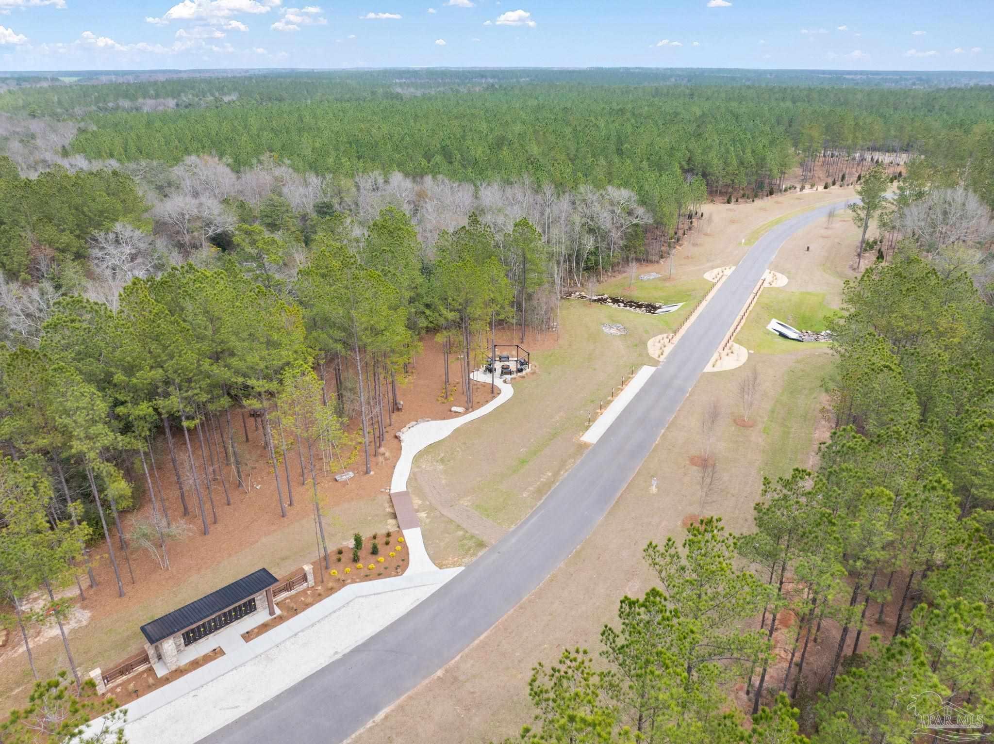 27 Ashbridge Lane Pace, FL 32571 - Photo 15 of 40 a view of a lake from a balcony