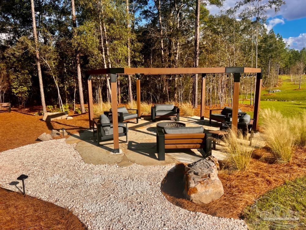 27 Ashbridge Lane Pace, FL 32571 - Photo 27 of 40 a view of a swimming pool with lounge chairs