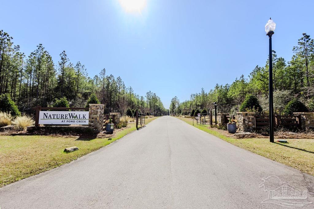27 Ashbridge Lane Pace, FL 32571 - Photo 3 of 40 a view of a street with a building in the background