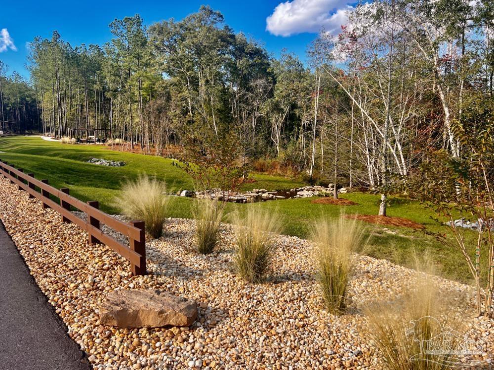 27 Ashbridge Lane Pace, FL 32571 - Photo 31 of 40 a view of a lake with a yard