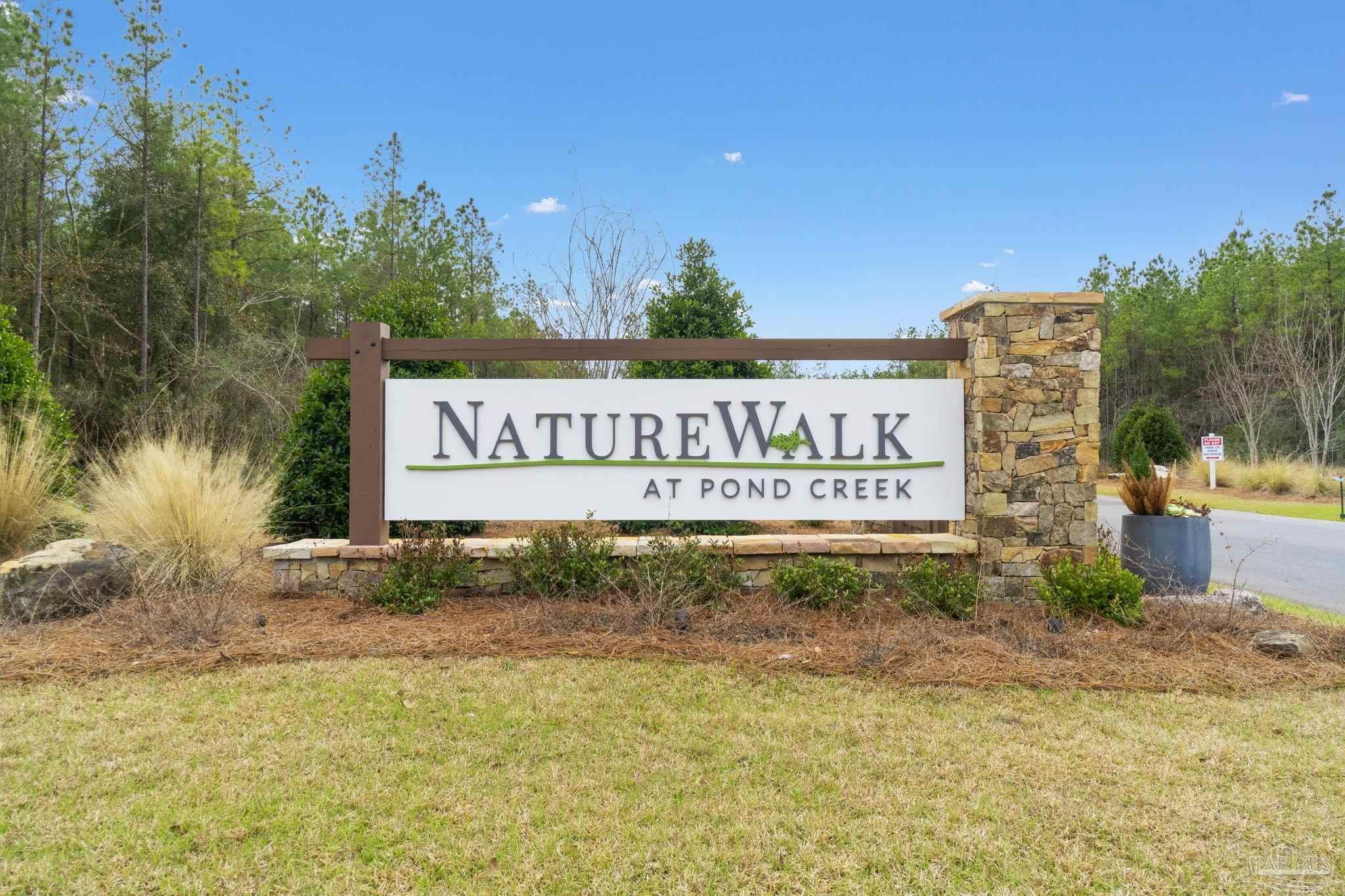 27 Ashbridge Lane Pace, FL 32571 - Photo 40 of 40 a sign board with parking space