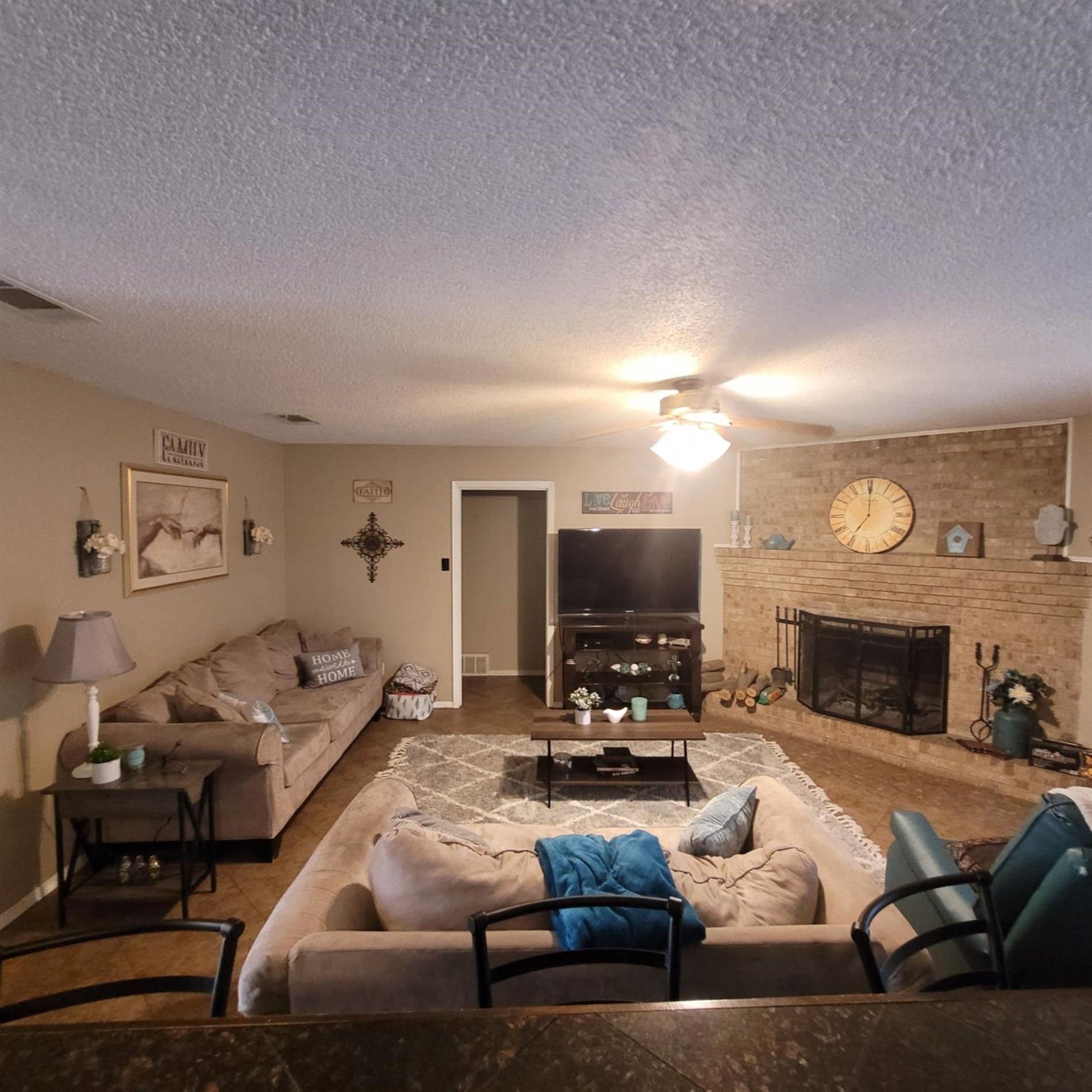5519 1st Place Lubbock, TX 79416 - Photo 3 of 13 a living room with furniture and a fireplace
