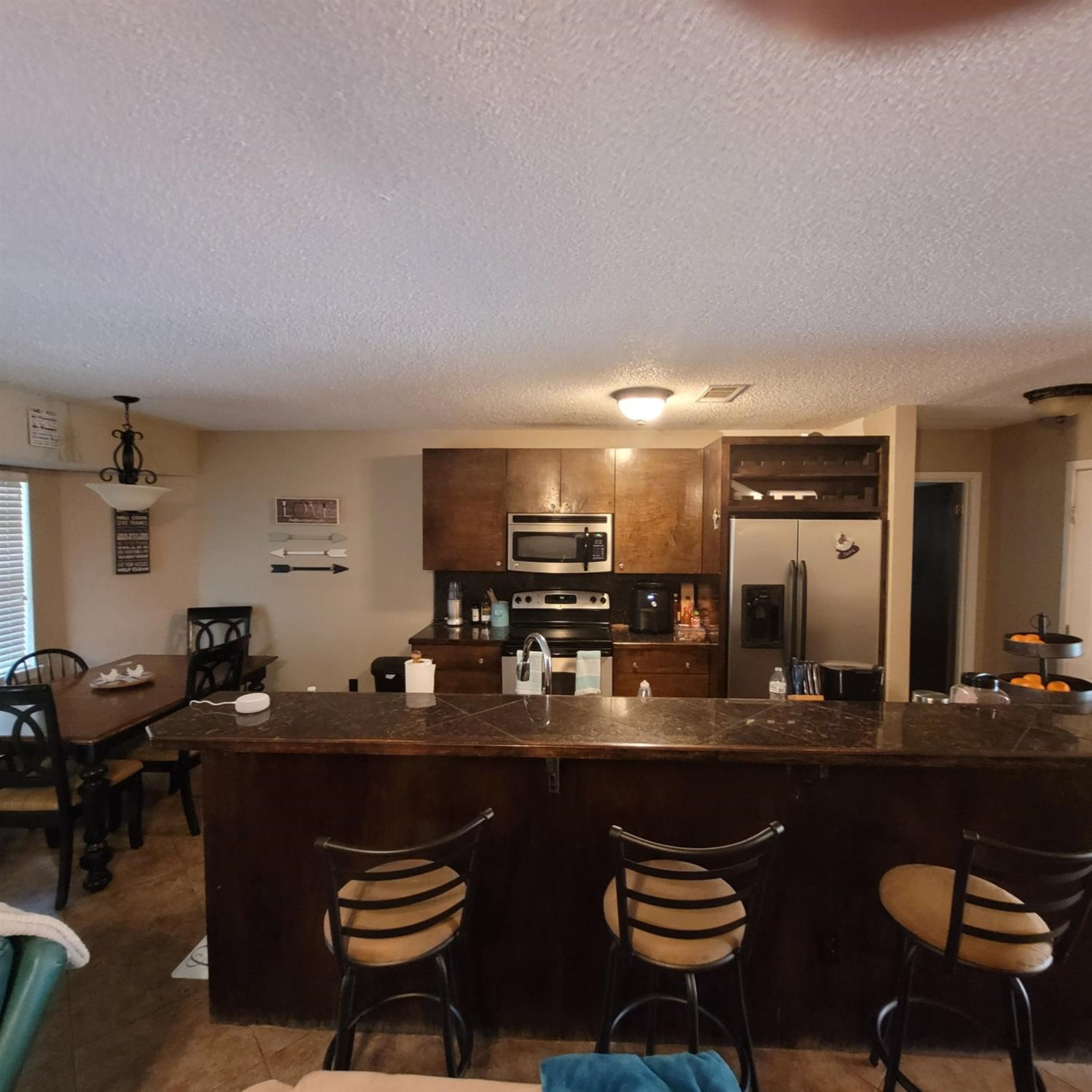 5519 1st Place Lubbock, TX 79416 - Photo 4 of 13 a kitchen with a table and chairs in it
