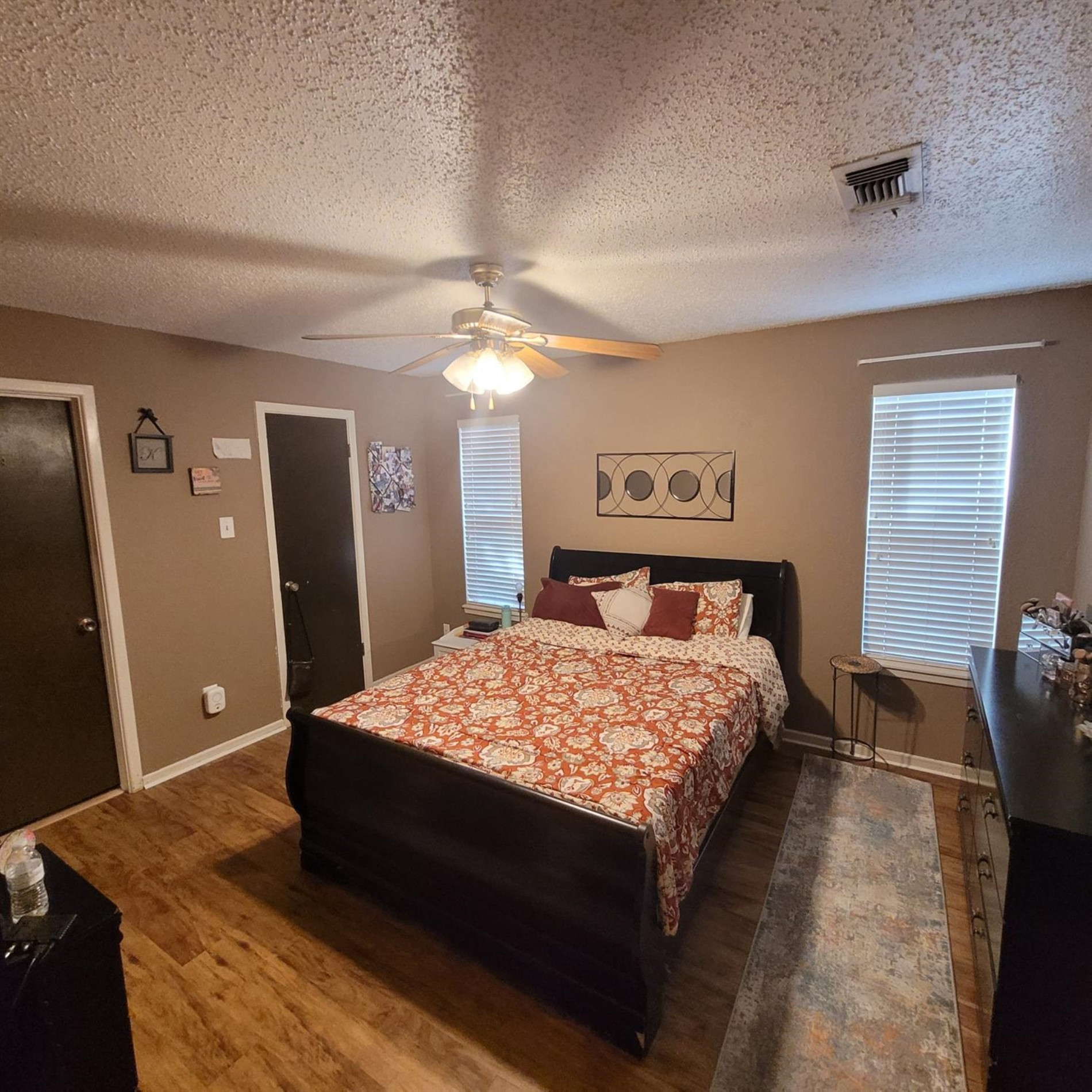 5519 1st Place Lubbock, TX 79416 - Photo 5 of 13 a bed sitting in a bedroom and a chandelier