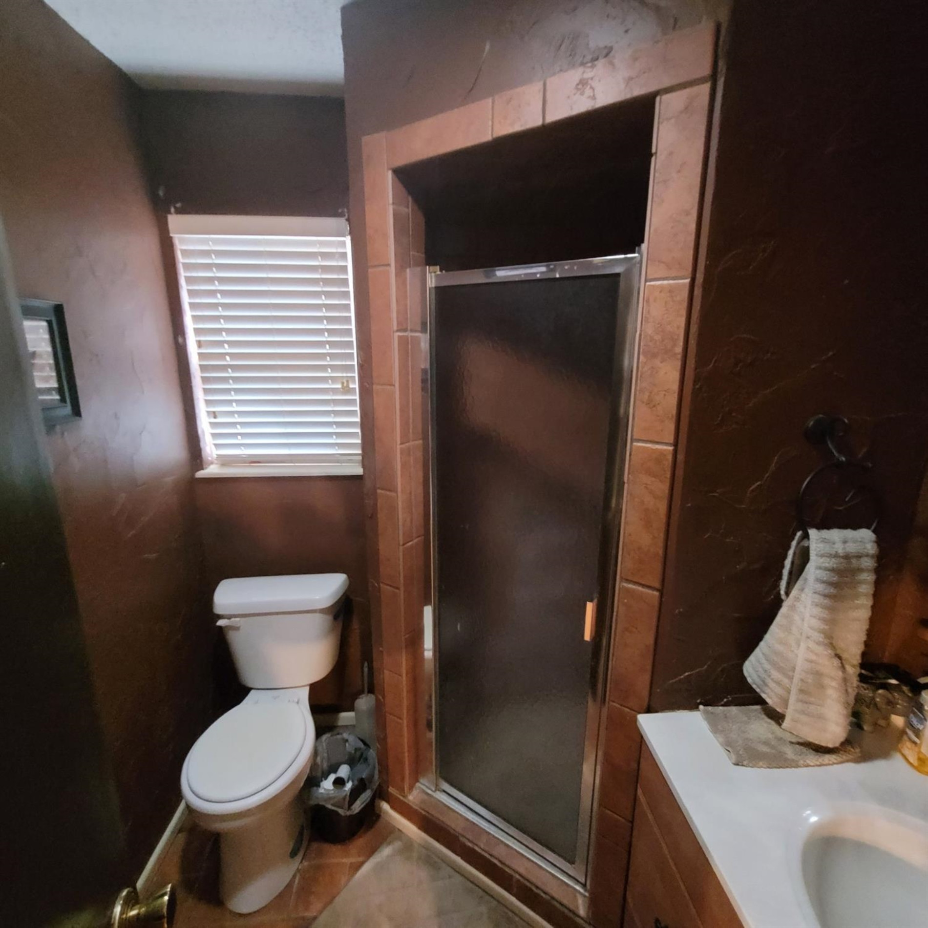 5519 1st Place Lubbock, TX 79416 - Photo 6 of 13 a bathroom with a toilet and a sink