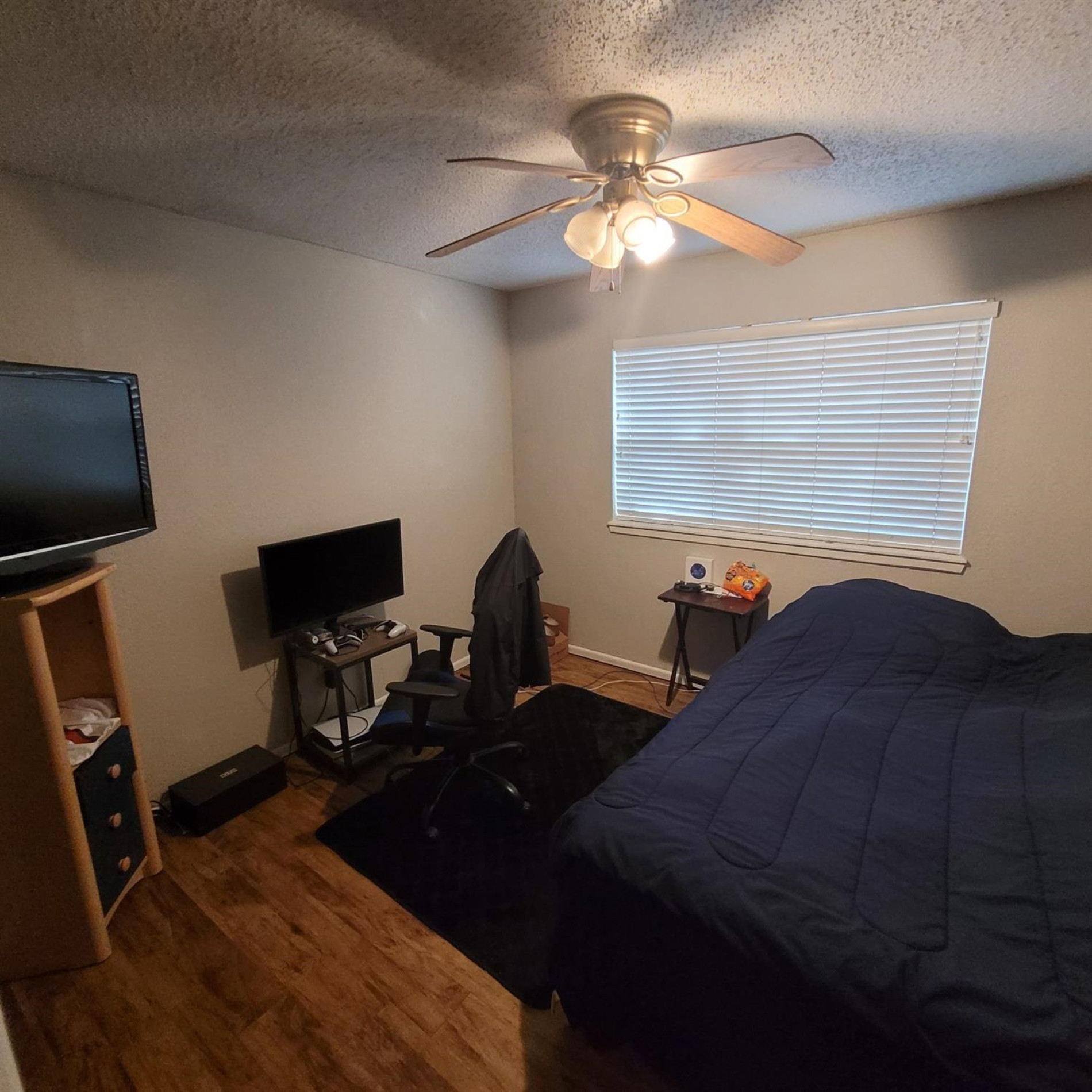 5519 1st Place Lubbock, TX 79416 - Photo 8 of 13 a bedroom with a bed and a desk