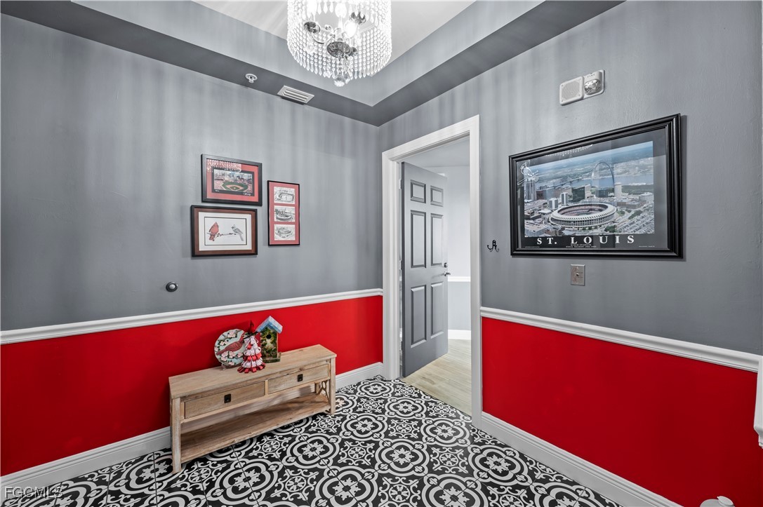 2745 First Street, Unit 1306 Fort Myers, FL 33916 - Photo 5 of 50 a living room with furniture and a chandelier