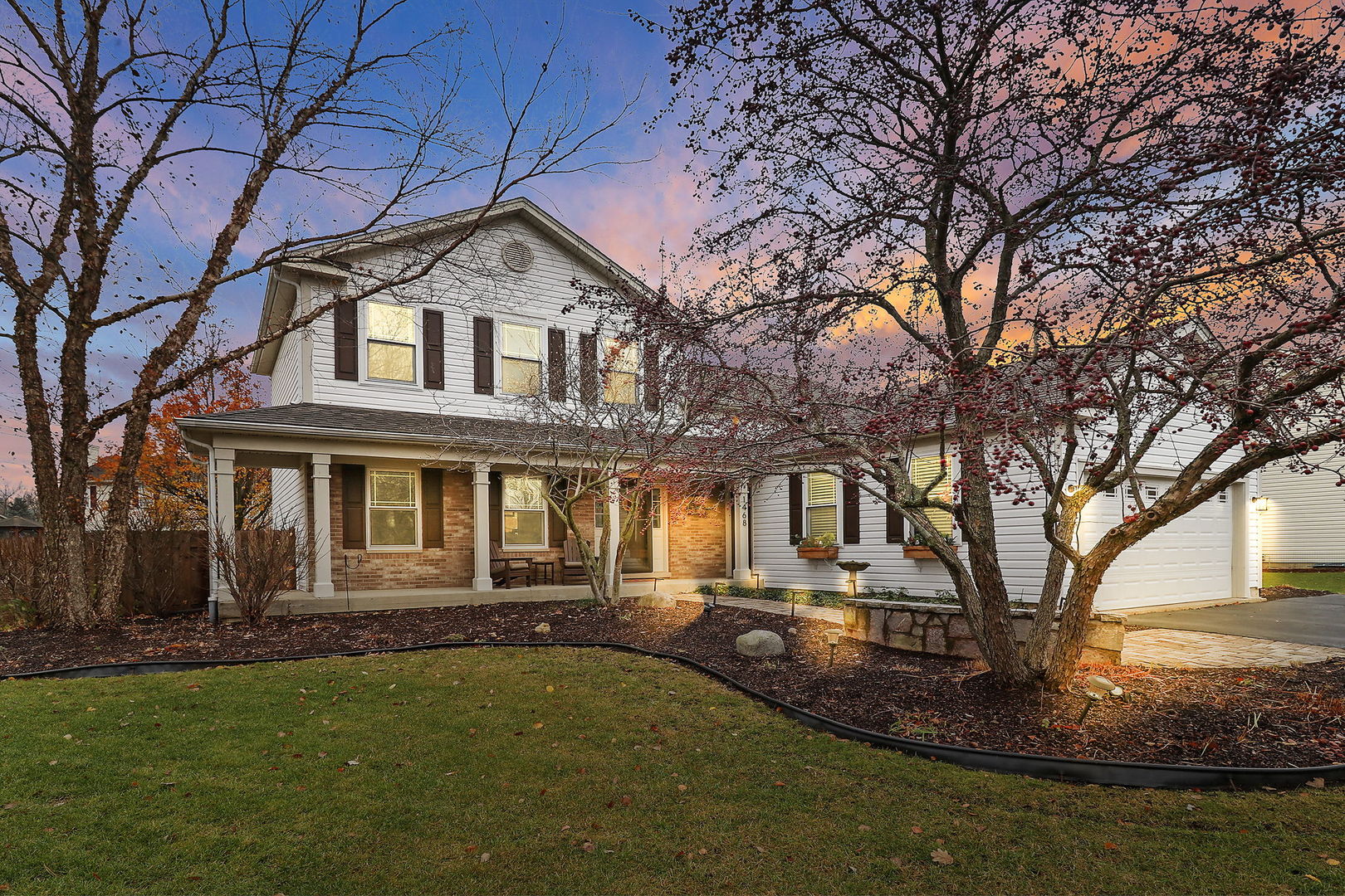 a front view of a house with a yard