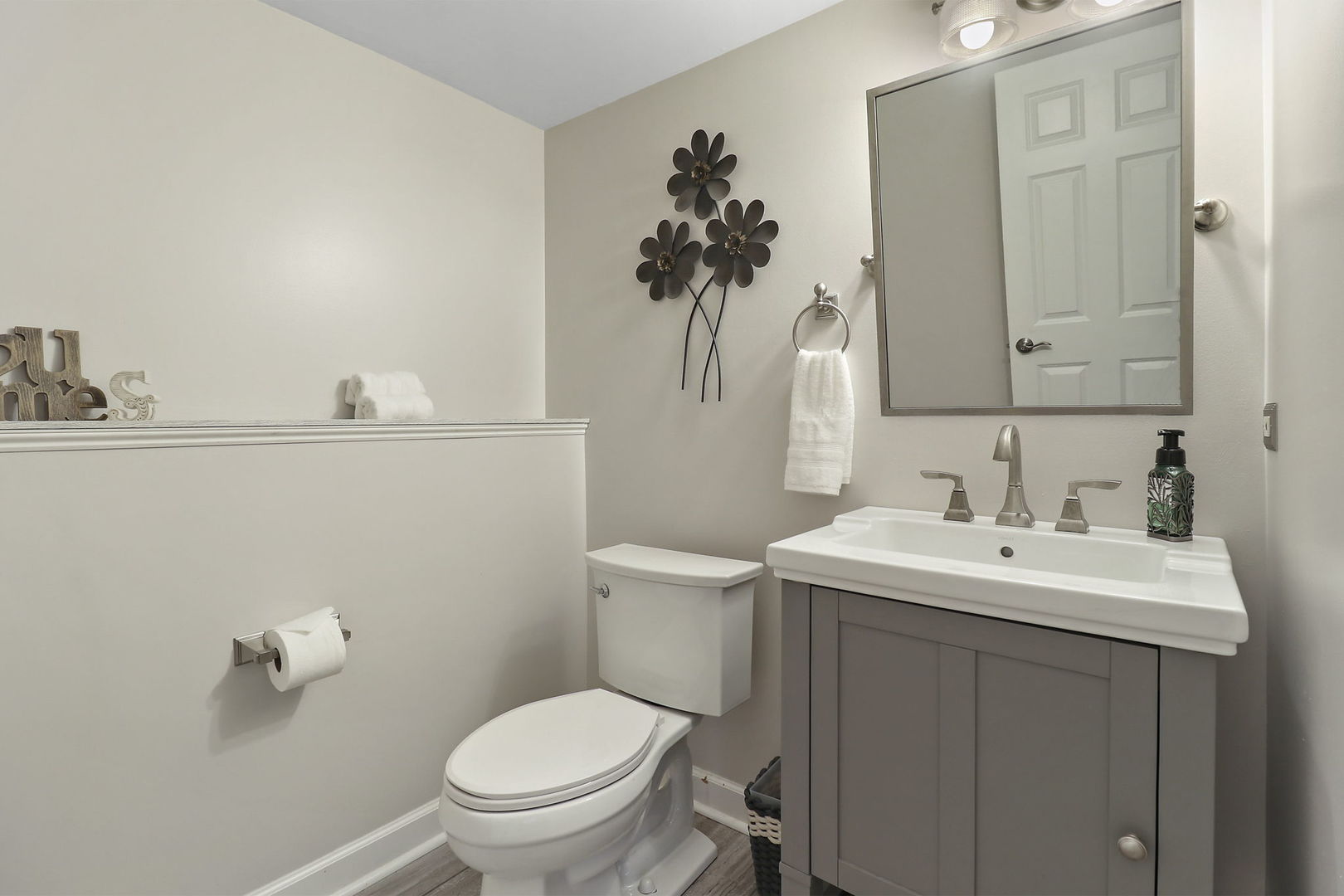 1468 Sutton Circle Wauconda, IL 60084 - Photo 22 of 33 a bathroom with a toilet a sink and mirror
