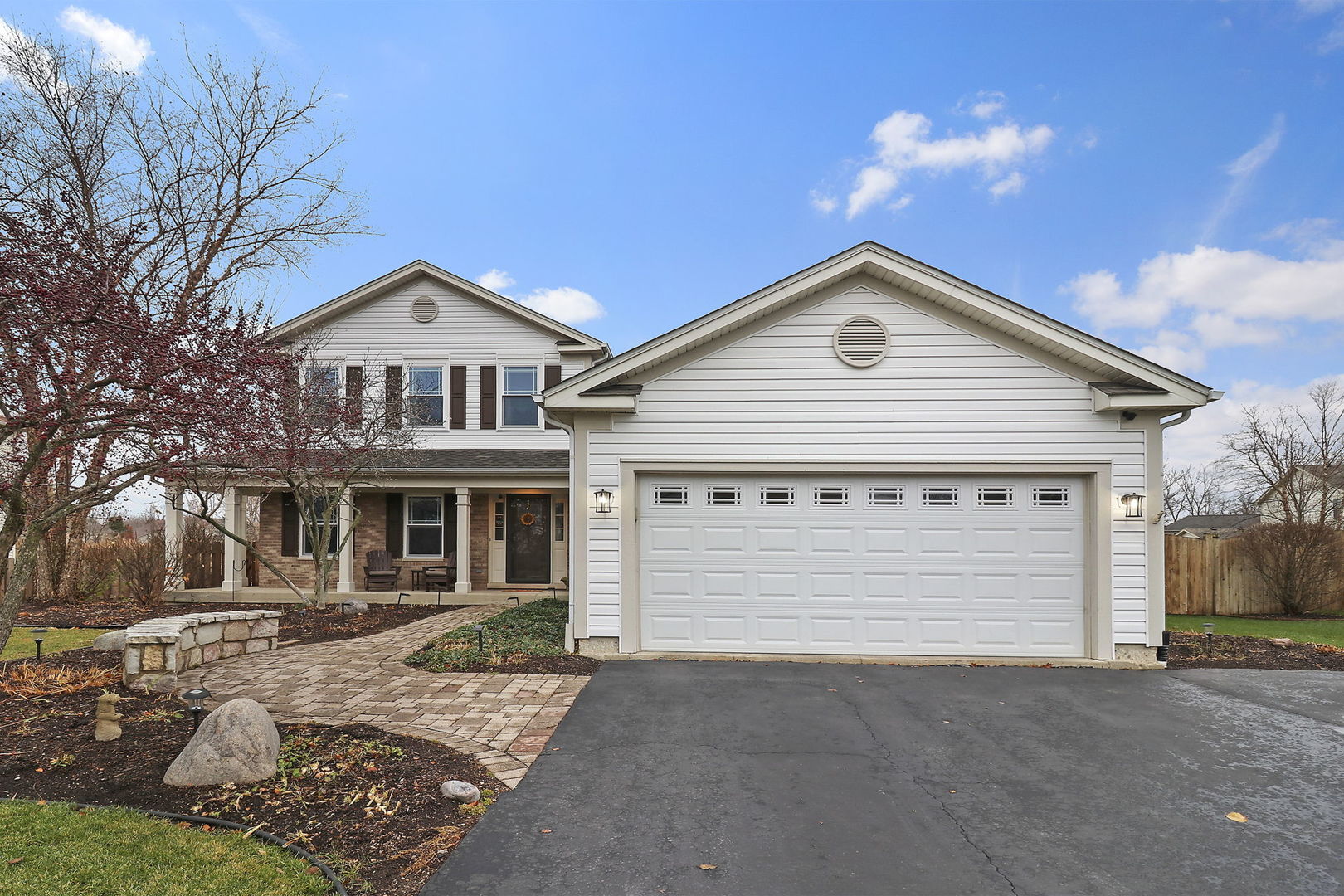 1468 Sutton Circle Wauconda, IL 60084 - Photo 24 of 33 a front view of a house with a yard and garage