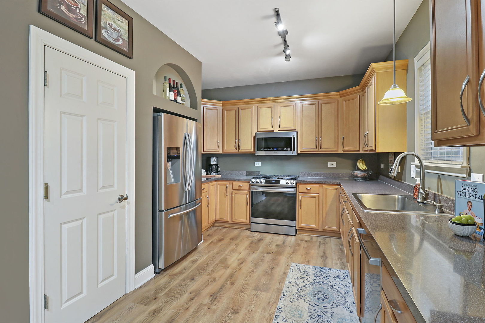 1468 Sutton Circle Wauconda, IL 60084 - Photo 7 of 33 a kitchen with stainless steel appliances granite countertop a refrigerator a stove top oven a sink and dishwasher
