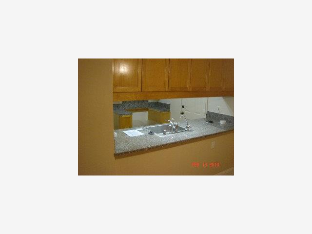 2005 Olivera Road, Unit B Concord, CA 94520 - Photo 2 of 8 a bathroom with a sink and a mirror