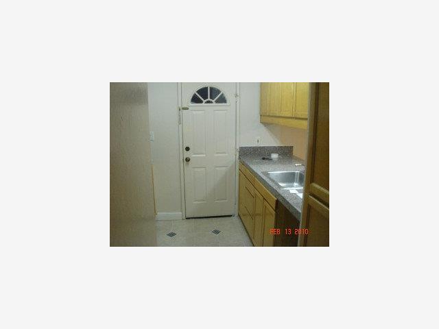 2005 Olivera Road, Unit B Concord, CA 94520 - Photo 6 of 8 a kitchen with a sink and stainless steel appliances
