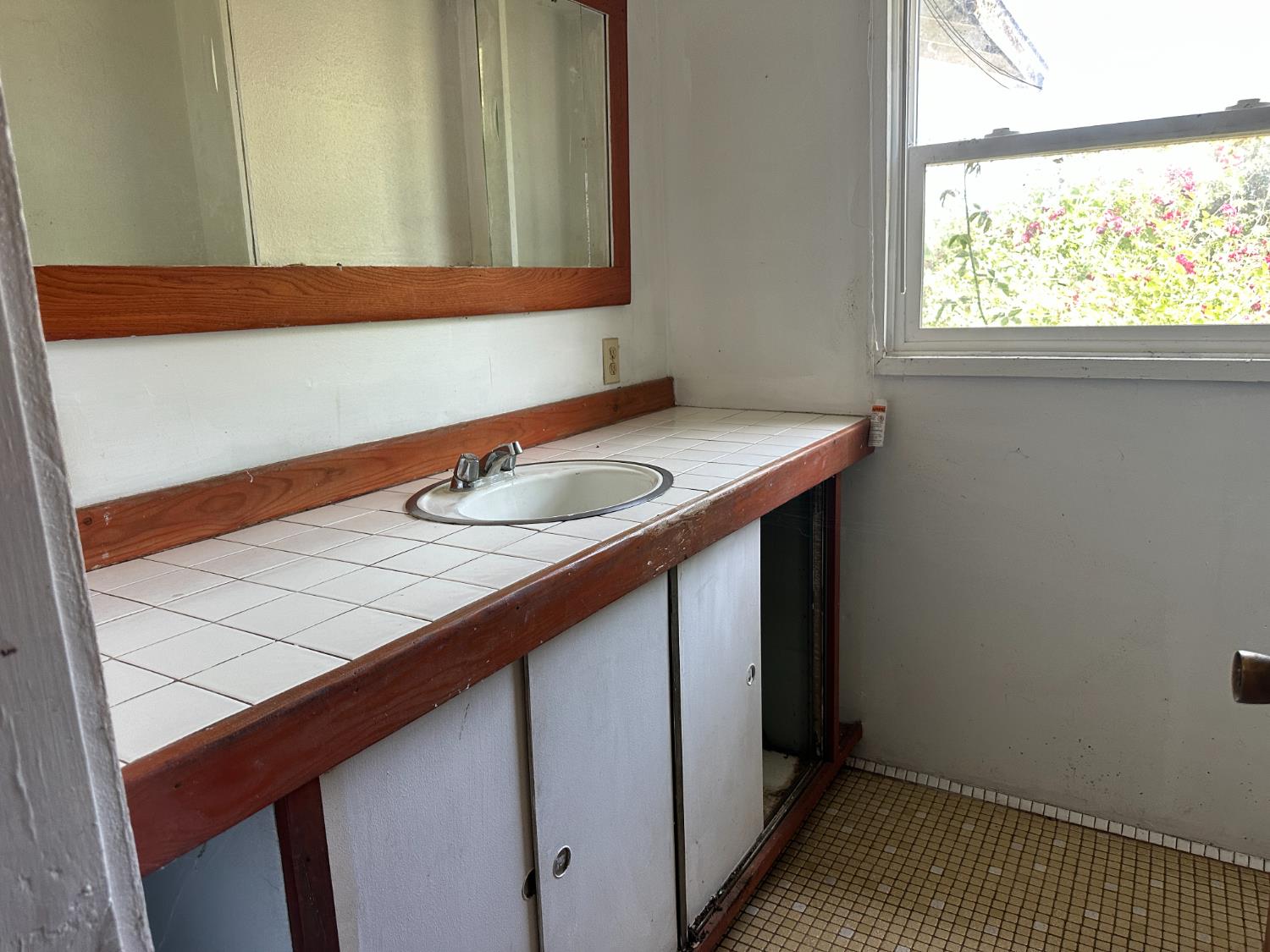 19637 East American Avenue Reedley, CA 93654 - Photo 14 of 40 a bathroom with a sink and a mirror