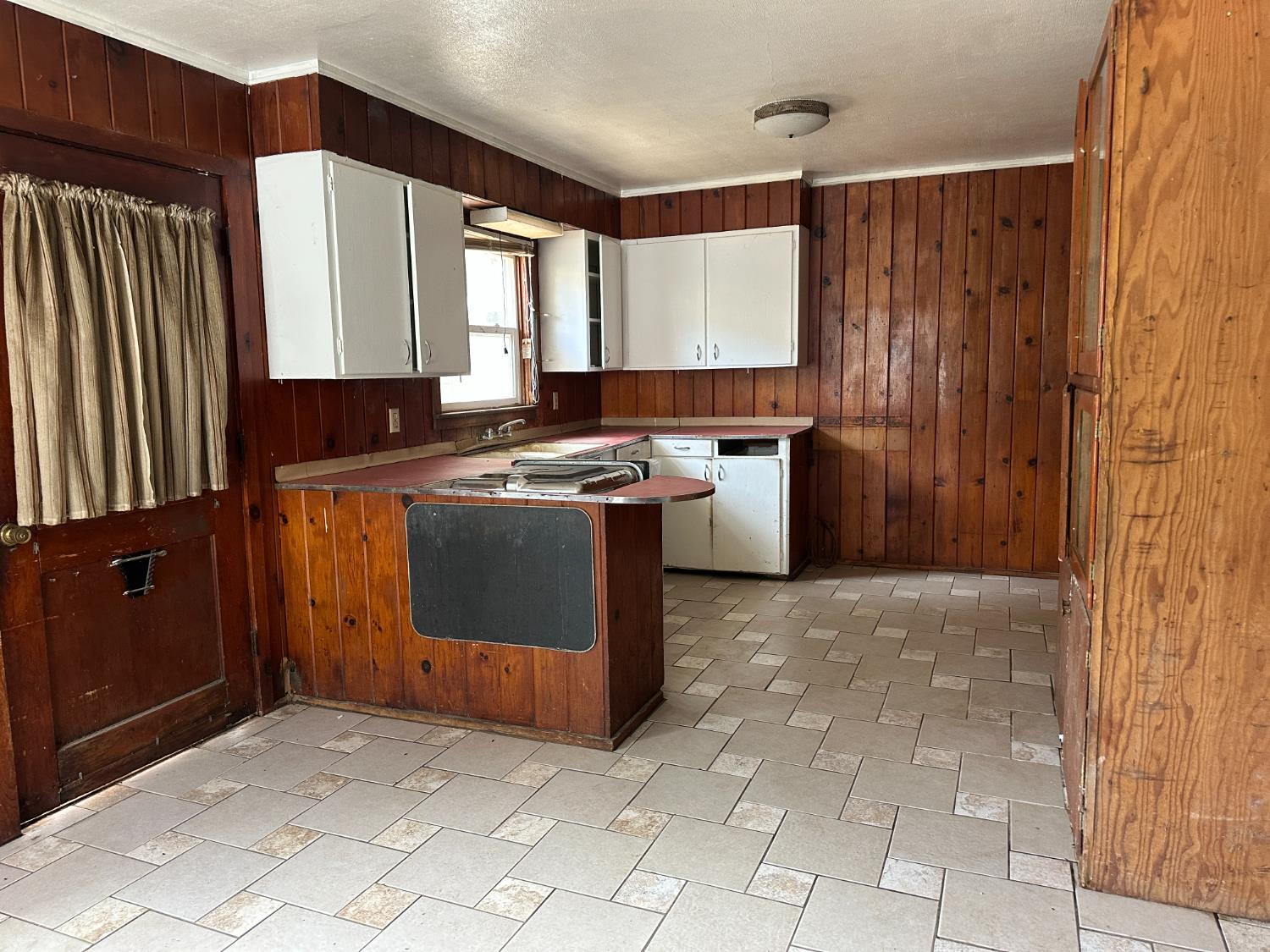 19637 East American Avenue Reedley, CA 93654 - Photo 2 of 40 a kitchen with stainless steel appliances granite countertop a stove a sink and a microwave