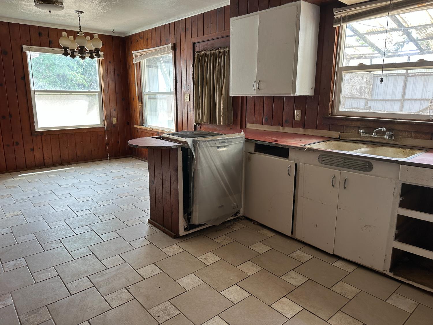 19637 East American Avenue Reedley, CA 93654 - Photo 3 of 40 a kitchen with a sink cabinets and window