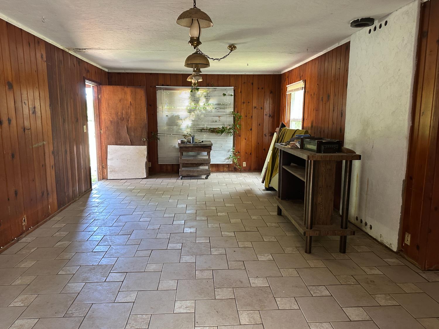 19637 East American Avenue Reedley, CA 93654 - Photo 4 of 40 a view of a livingroom with furniture and a window