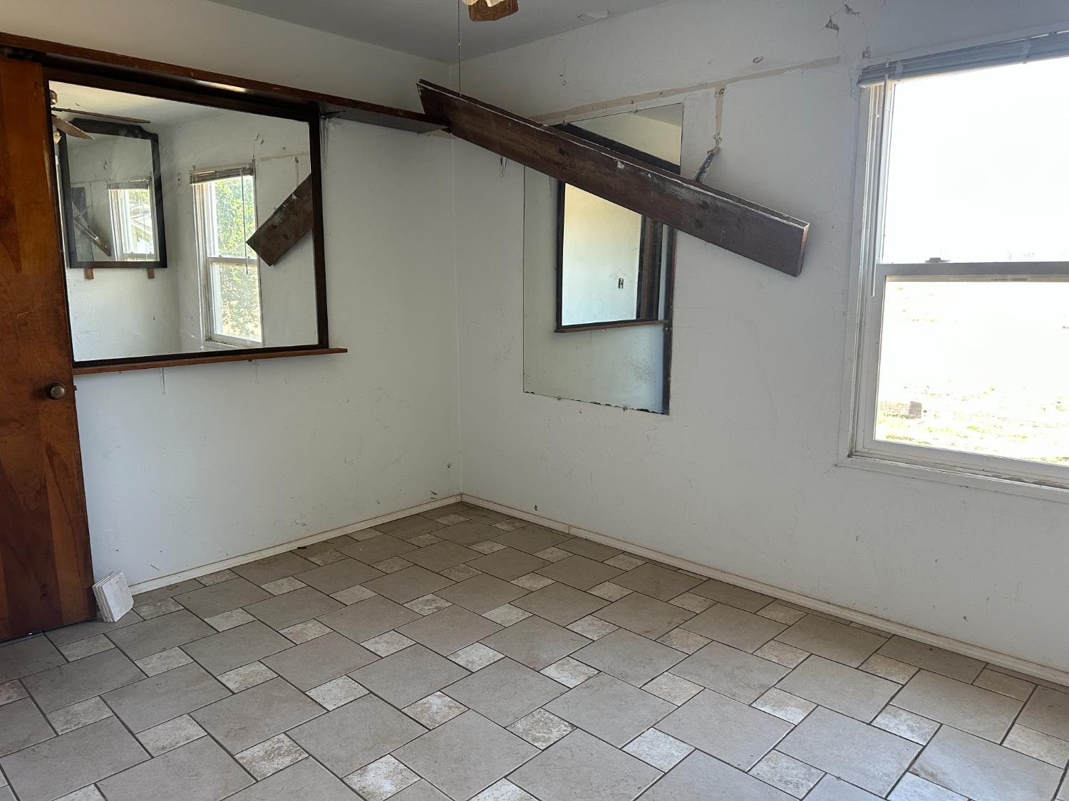 19637 East American Avenue Reedley, CA 93654 - Photo 10 of 40 an empty room with windows