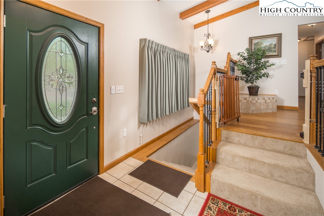 358 Benge Ashe Road Purlear, NC 28665 - Photo 4 of 50 a view of a entryway door with wooden floor
