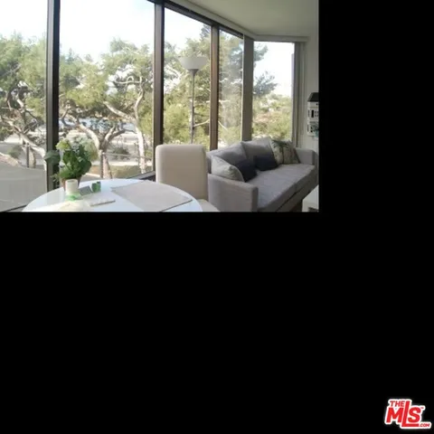 a view of an outdoor space with furniture