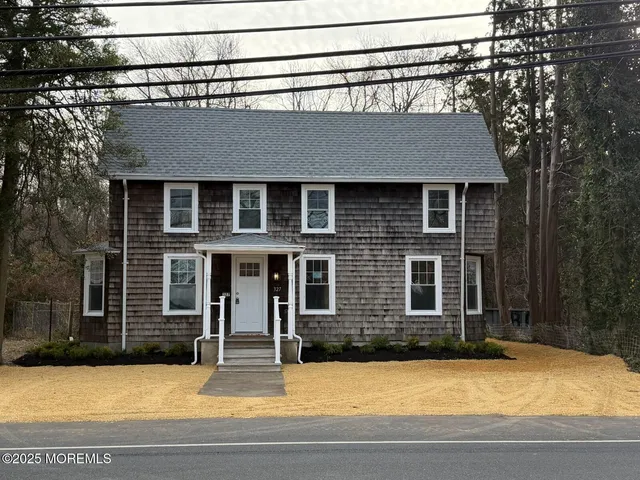 a view of a house with roof deck