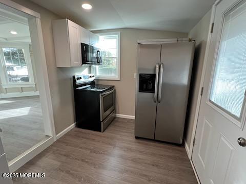327 Mantoloking Road Brick, NJ 08723 - Photo 6 of 12 a kitchen with stainless steel appliances granite countertop a refrigerator and a sink