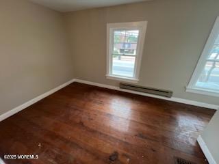 327 Mantoloking Road Brick, NJ 08723 - Photo 10 of 12 an empty room with wooden floor and windows