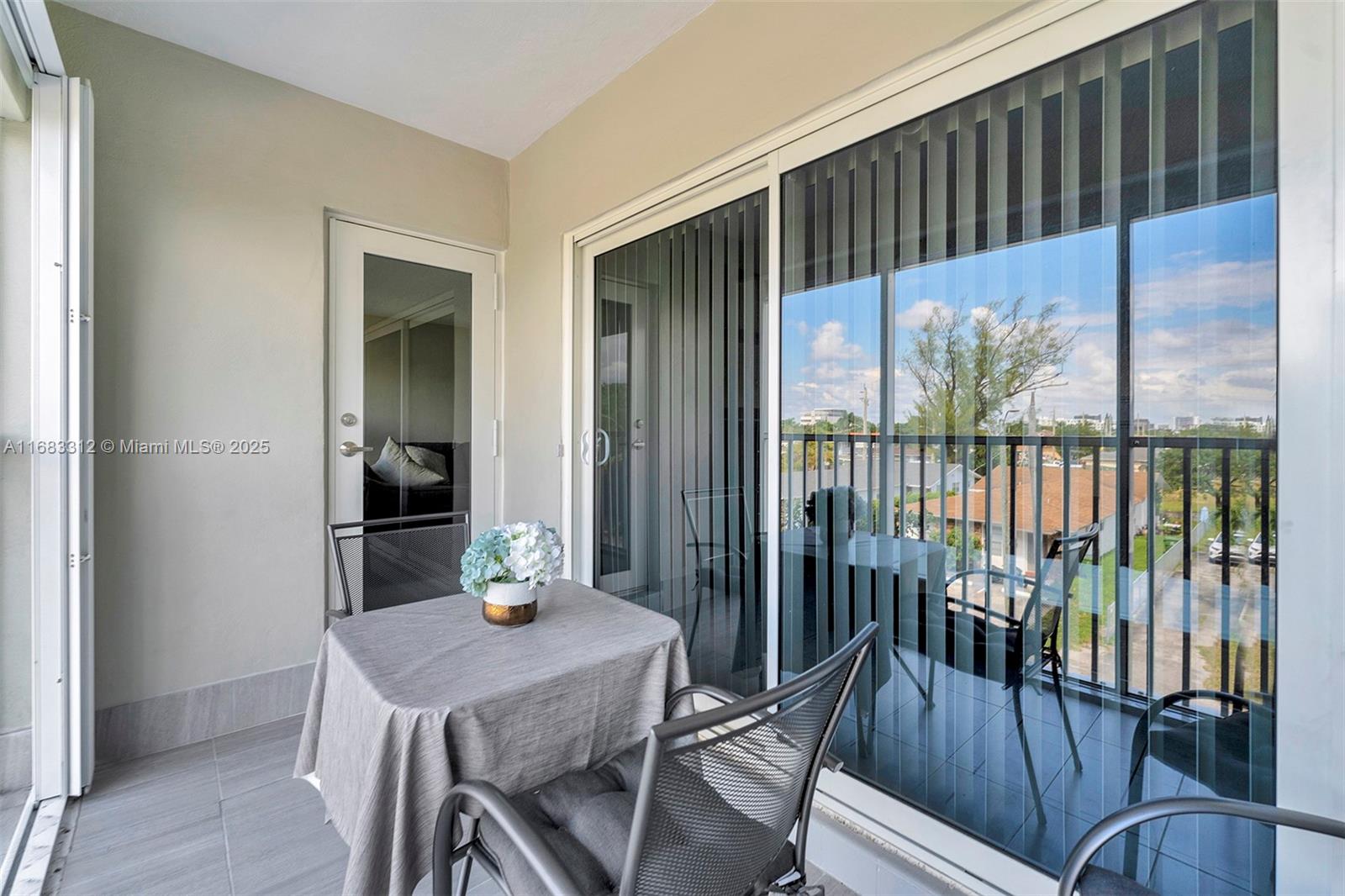 330 Southeast 2nd Street, Unit 303F Hallandale Beach, FL 33009 - Photo 19 of 26 a view of a dining room with furniture window and wooden floor