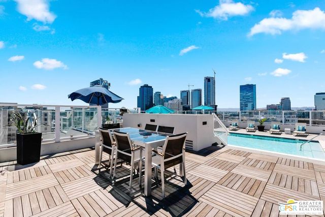 a view of a terrace with furniture and stove
