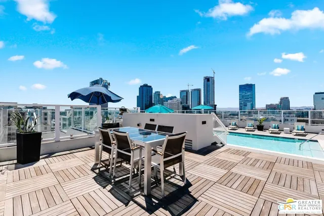 a view of a terrace with furniture and stove