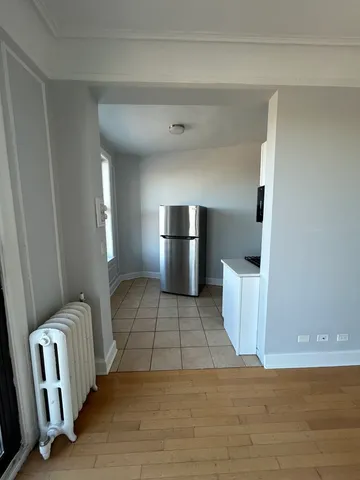 a view of kitchen with furniture and stove