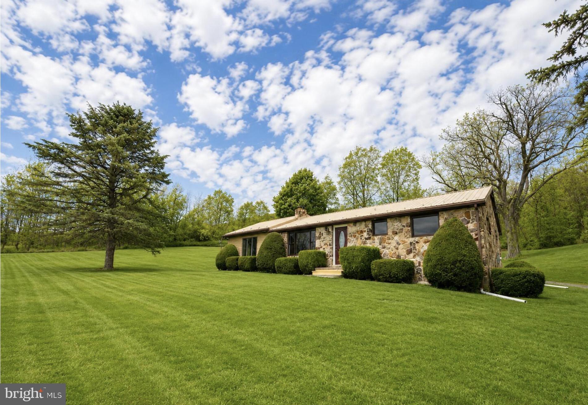 4805 Buffalo Run Road Port Matilda, PA 16870 - Photo 23 of 29 Charming stone home on lush green lawn.