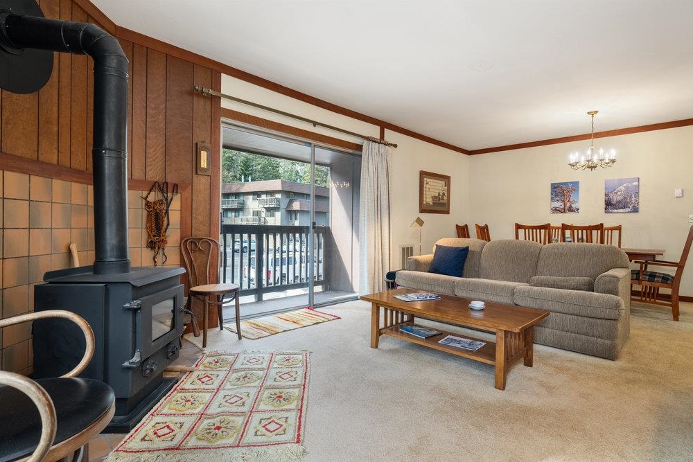 440 Shirley Cyn Road, Unit 50 Olympic Valley, CA 96146 - Photo 13 of 28 a living room with furniture and a fireplace