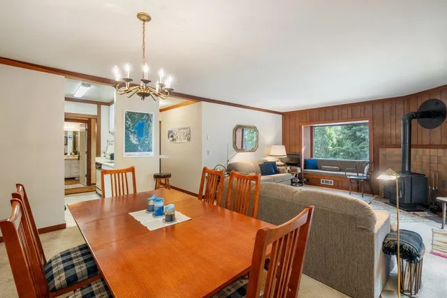 a view of a dining room with furniture window and outside view
