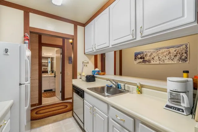 a kitchen with a sink and cabinets